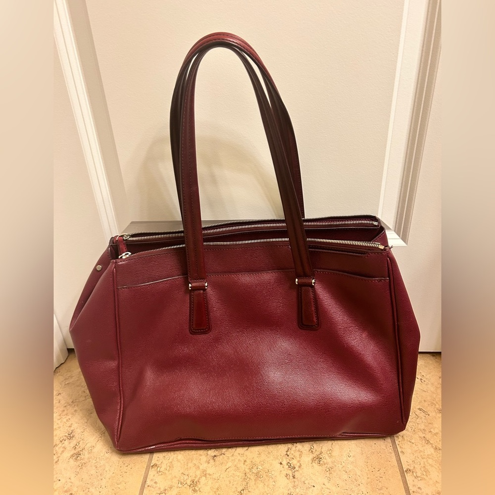 Tumi purple briefcase. Good condition.